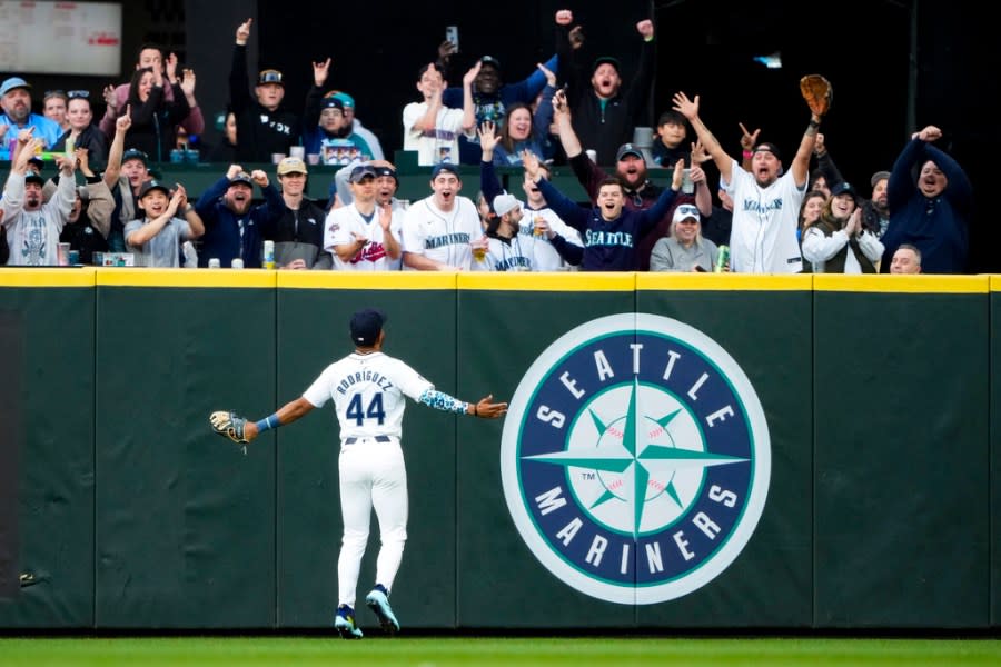 Seattle Mariners center fielder Julio Rodríguez turns to the crowd after making a leaping catch on a fly ball hit by Cleveland Guardians’ Will Brennan during the second inning of a baseball game Monday, April 1, 2024, in Seattle. (AP Photo/Lindsey Wasson)