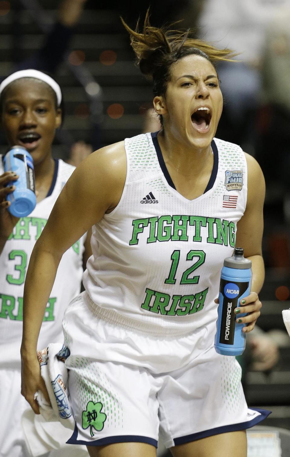 Notre Dame forward Taya Reimer (12) celebrates during the second half of the semifinal game against Maryland in the Final Four of the NCAA women's college basketball tournament, Sunday, April 6, 2014, in Nashville, Tenn. Notre Dame won 87-61. (AP Photo/Mark Humphrey)