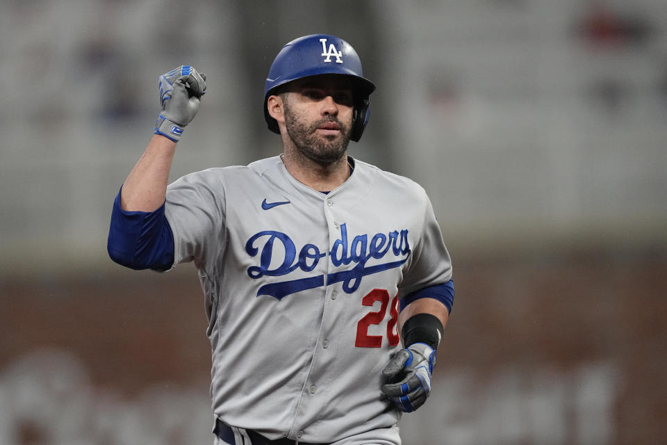Los Angeles Dodgers designated hitter J.D. Martinez reacts as he rounds the bases after hitting a solo home run in the seventh inning of a baseball game against the Atlanta Braves, Monday, May 22, 2023, in Atlanta. (AP Photo/John Bazemore)