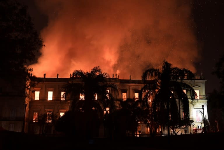 As the flames raged researchers, professors and university students expressed a mix of sorrow and indignation, with some calling for demonstrations Monday in front of the ravaged building