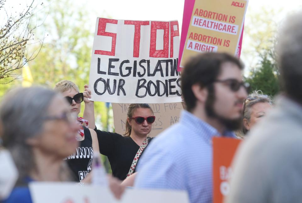 Dozens of people gather adjacent to the J. Caleb Boggs Federal Building & U.S. Courthouse in Wilmington to protest the potential Supreme Court ruling that would likely make abortion illegal in large parts of the United States, Tuesday, May 3, 2022.