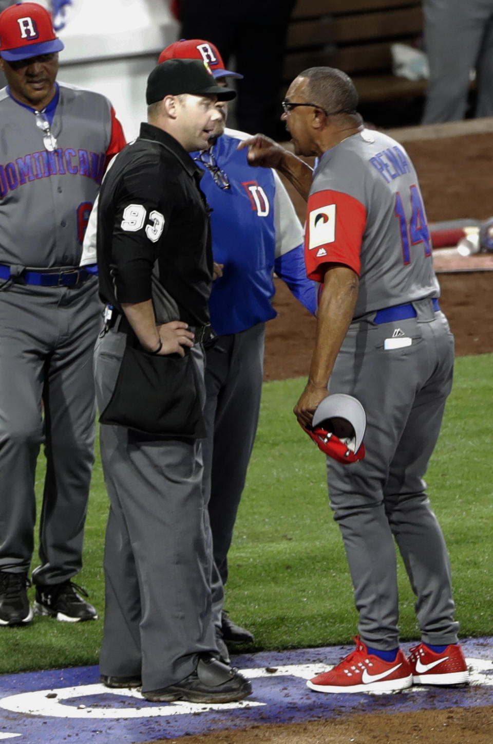 Dominican Republic Manager Tony Pena, right, has words with home plate umpire Will Little before being ejected during the eighth inning of a second-round World Baseball Classic game Tuesday, March 14, 2017, in San Diego. (AP Photo/Gregory Bull)