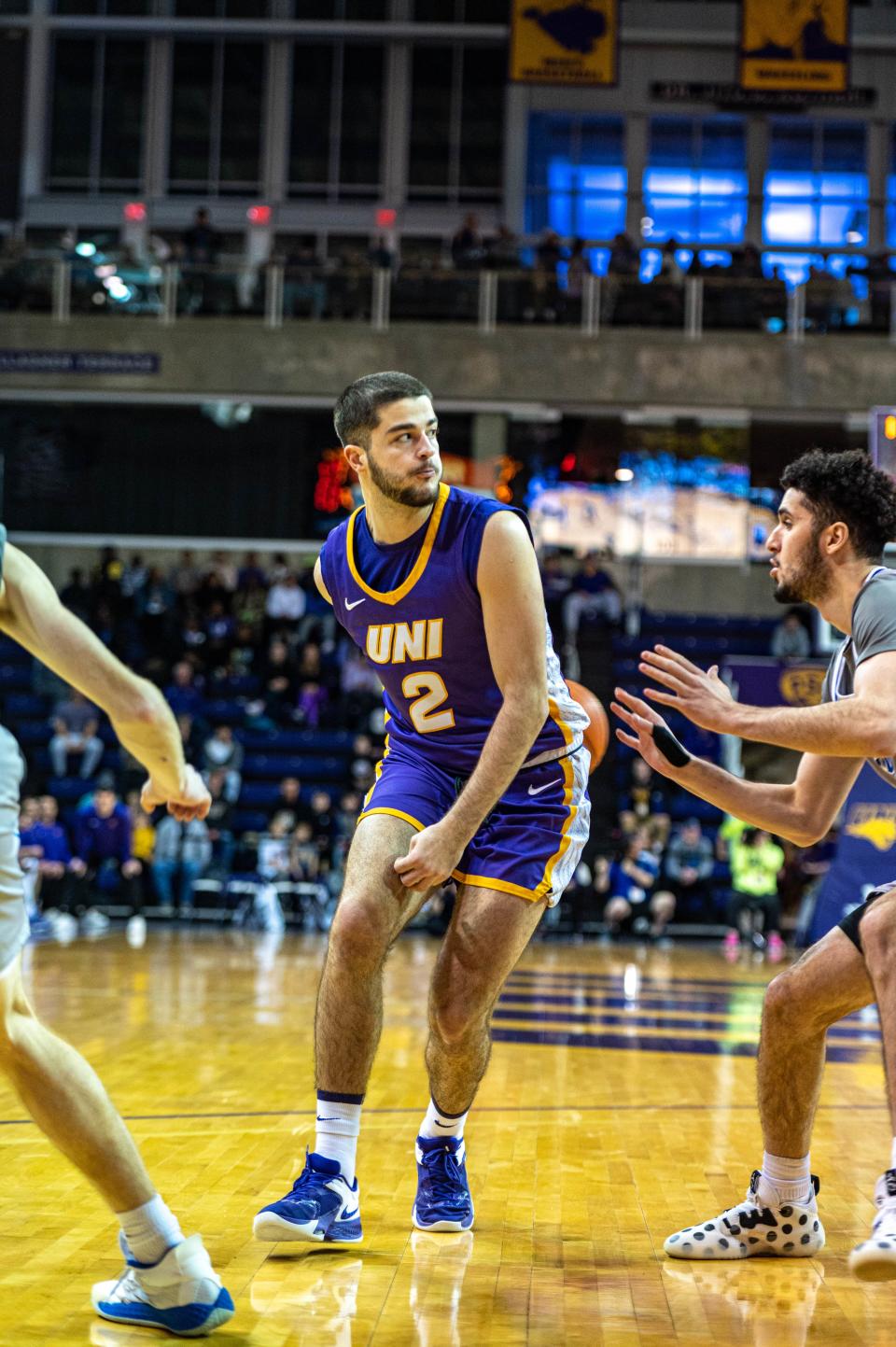 UNI basketball's Ege Peksari attempts to make a pass while Drake's Okay Djamgouz defends. Peksari and Djamgouz are the only Turkish players in the Missouri Valley Conference.