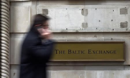 A worker walks past The Baltic Exchange in London, Britain, March 2, 2016. REUTERS/Toby Melville/File Photo