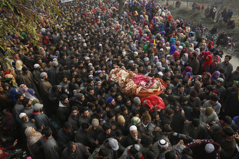 Kashmiri Muslim villagers carry the body of rebel Abid chopan during his funeral at Shopian, south of Srinagar, Indian controlled Kashmir, Tuesday, Nov. 20, 2018. Four rebels and an Indian army commando were killed in fighting in disputed Kashmir on Tuesday, triggering anti-India protests and clashes in the restive region. (AP Photo/Mukhtar Khan)