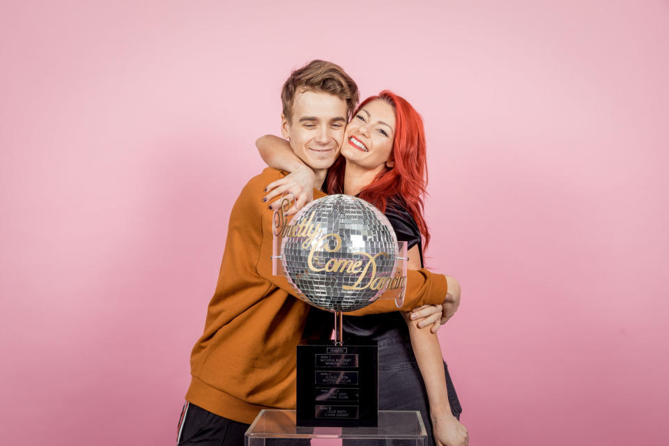 Joe Sugg and girlfriend Dianne Buswell with the Strictly Come Dancing glitter ball ahead of the 2018 final.