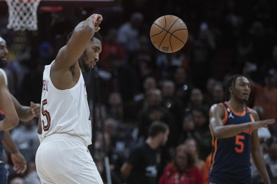 Cleveland Cavaliers' Donovan Mitchell (45) lets go of the ball at the end of Game 5 of the team's NBA basketball first-round playoff series against the New York Knicks, Wednesday, April 26, 2023, in Cleveland. The Knicks won 106-95, taking the series. (AP Photo/Phil Long)