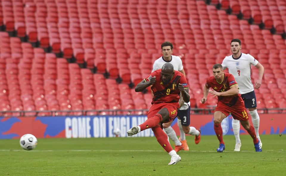 Belgium's Romalu Lukaku scores the opening goal from the penalty spot during the UEFA Nations League soccer match between England and Belgium at Wembley stadium in London, Sunday, Oct. 11, 2020. (Neil Hall/Pool via AP)