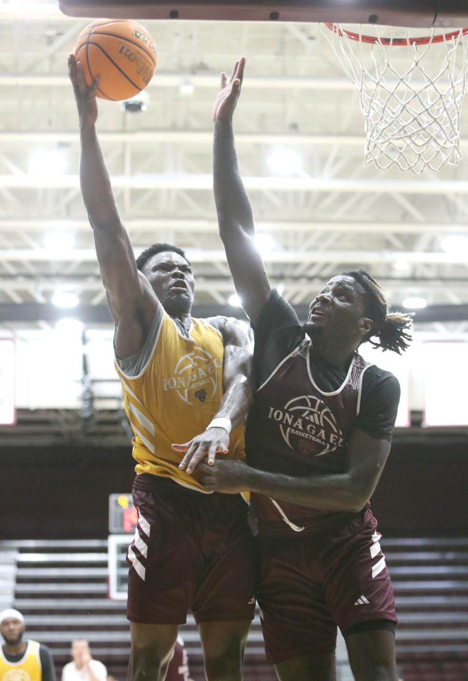 Iona basketball's Comeh Emuobor, left, and Yaphet Moundi, right, during an open practice at Hynes Athletic Center in New Rochelle.  August 3, 2024.