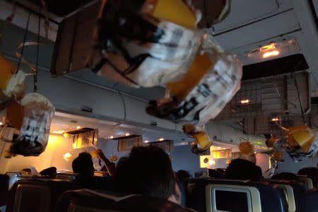 Oxygen masks are seen deployed after a loss of cabin pressure, on a Jet Airways flight, from Mumbai, India September 20, 2018 in this still image obtained from social media. Melissa Tixiera via REUTERS