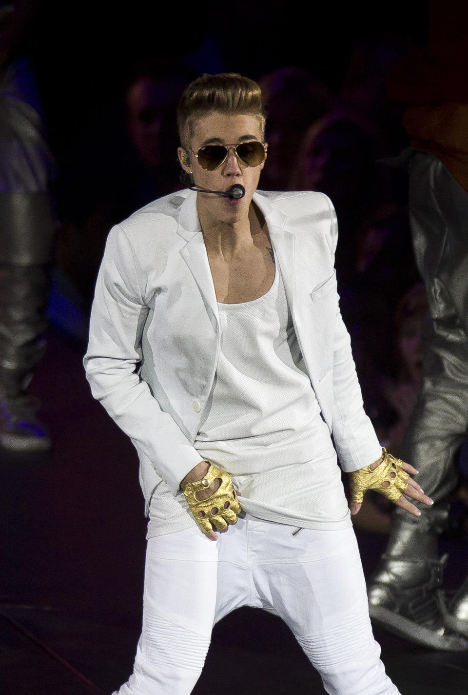 FILe - In this Monday, March 4, 2013 file photo, Canadian singer Justin Bieber performs at the O2 Arena in east London. Bieber is recovering after fainting backstage at a concert in London. A spokeswoman for Bieber said Thursday, March 7, 2013, that the 19-year-old pop star was given oxygen and took a 20-minute reprieve after fainting backstage at London's O2 Arena. (Photo by Joel Ryan/Invision/AP, File)