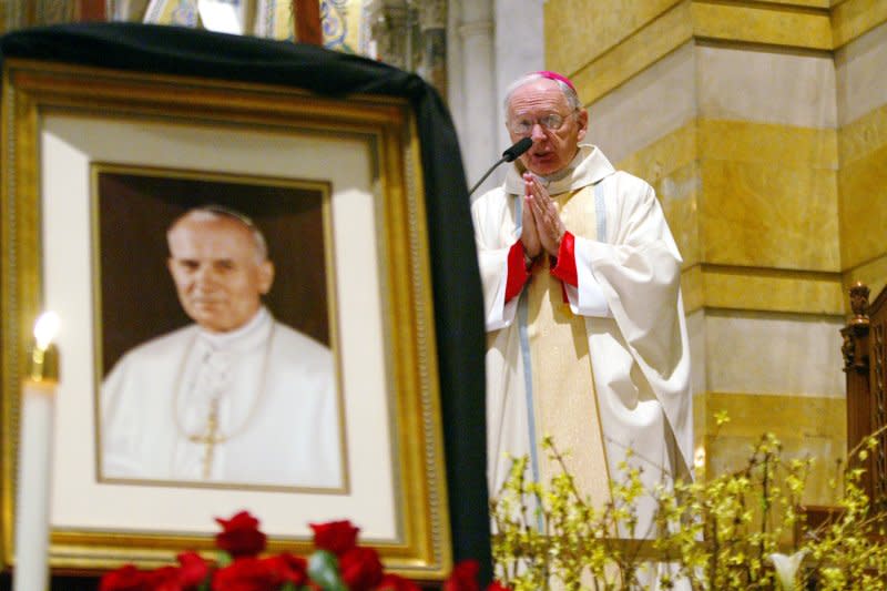 Bishop Robert Hermann celebrates a mass in honor of the late Pope John Paul II at the Cathedral Bascillica in St. Louis on April 3, 2005. The pontiff died April 2, 2005. File Photo by Bill Greenblatt/UPI