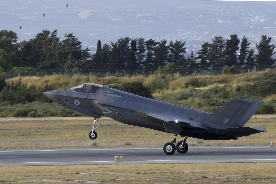 FILE - In this May 21, 2019, file photo, an F-35B aircraft lands at Akrotiri Royal air forces base near coastal city of Limassol, Cyprus. Japan’s defense spending is expected to set a new record next year as the country strengthens its military alliance with the U.S. and buys expensive American weapons amid threats from China and North Korea. Among the biggest purchases are six F-35B stealth fighters at 14 billion yen ($132 million) each for deployment in 2024. (AP Photo/Petros Karadjias, File)