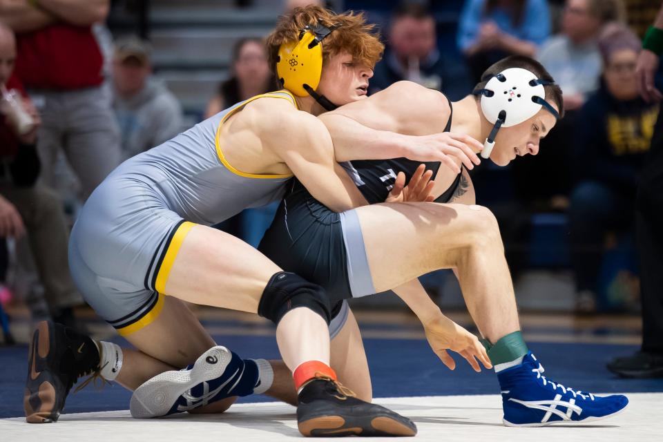 Red Lion's Mason Harvey (left) wrestles Chambersburg's Ashton Romberger in a 133-pound consolation semifinal bout at the PIAA District 3 Class 3A Wrestling Championships at Spring Grove Area High School on Saturday, Feb. 24, 2024, in Jackson Township.