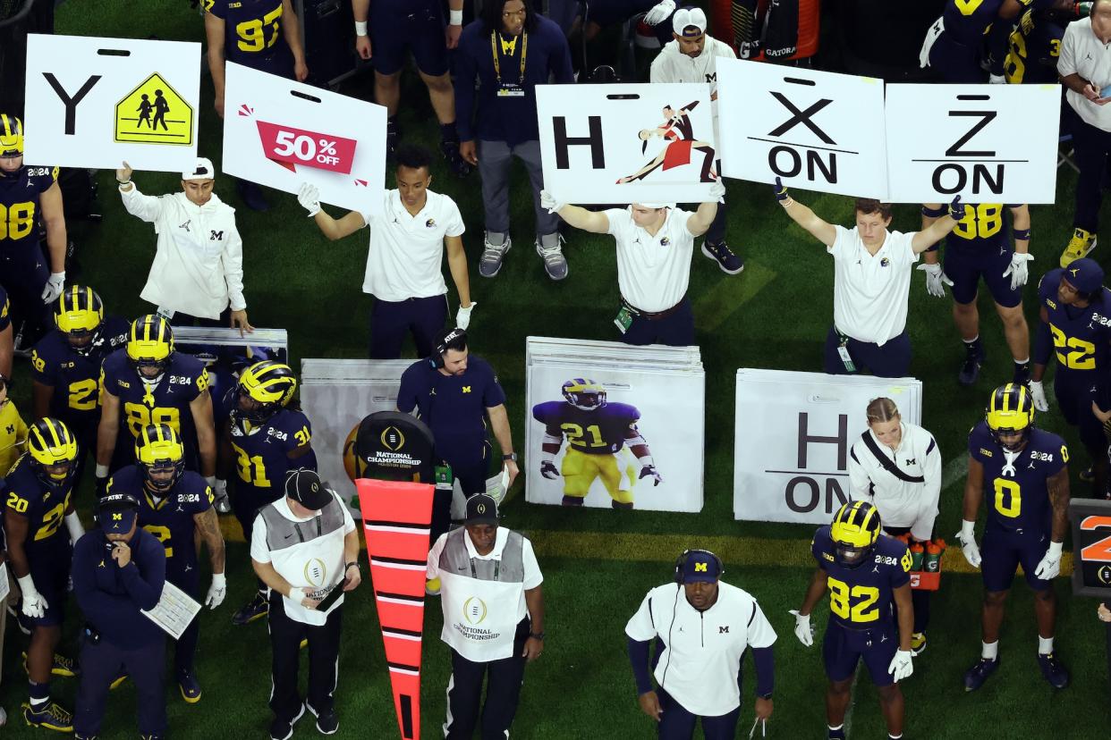 The use of these primitive play-calling signs could soon become a thing of the past. (Logan Riely/Getty Images)