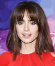<p>Collins center-parted fringe is a foolproof way to rock your bangs once they've grown out, but you don't have time to hit up the salon for a trim. </p>