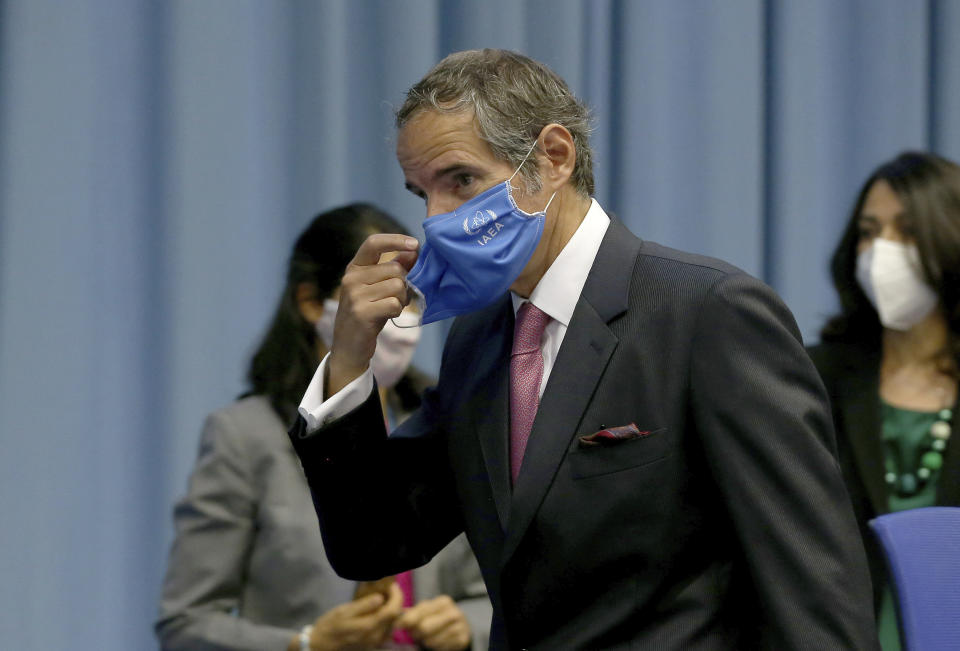 Director General of International Atomic Energy Agency, IAEA, Rafael Mariano Grossi from Argentina, adjusts his face mask for the start of the IAEA board of governors meeting at the International Center in Vienna, Austria, Monday, Sept. 14, 2020. (AP Photo/Ronald Zak)