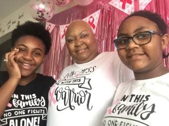 Nicole Nunn, middle, of Homewood, Ill., who is battling breast cancer, said she has the incredible support of her daughters, Imani, 14, left, and Zaria, 12, right, and her large family, many of whom are on Jasper, a site where Nunn uses to plan her appointments and treatments.
