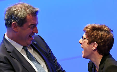 Christian Democratic Union (CDU) party leader Annegret Kramp-Karrenbauer is welcomed by Bavarian State Prime Minister and new leader of the Christian Social Union (CSU) Markus Soeder, at the CSU party meeting in Munich, Germany, January 19, 2019. REUTERS/Andreas Gebert