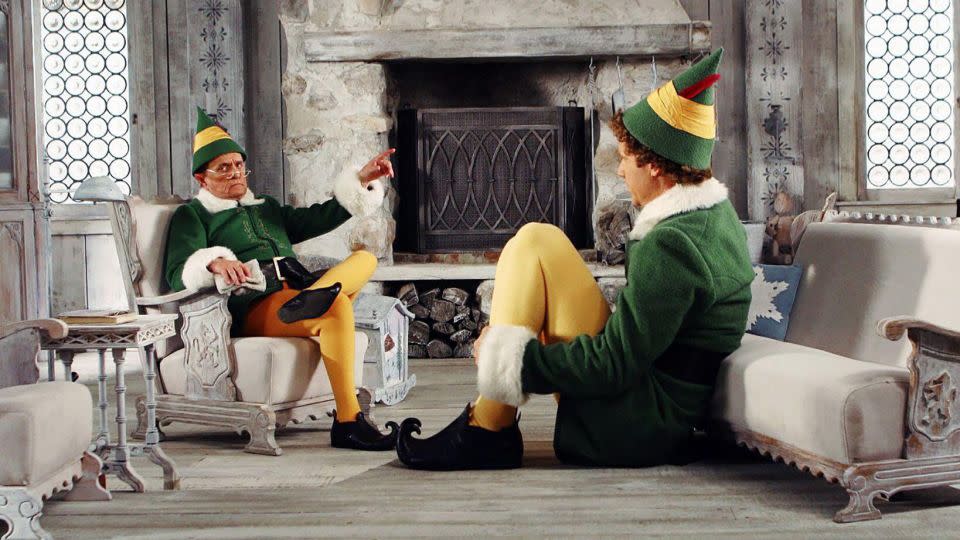 Bob Newhart and Will Ferrell in "Elf." - Cinematic/Alamy Stock Photo