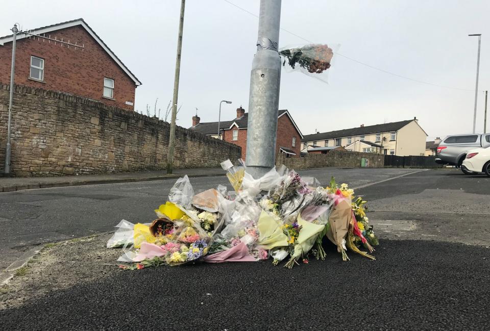 Flowers remain at the spot where Lyra McKee was killed