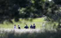 File - Investigators look over the scene in Oakland Township, Mich., June 17, 2013, where officials search for the remains of Teamsters union president Jimmy Hoffa who disappeared from a Detroit-area restaurant in 1975. The FBI's recent confirmation that it was looking at a spot near a New Jersey landfill as the possible burial site of former Teamsters boss Jimmy Hoffa is the latest development in a search that began when he disappeared. (AP Photo/Carlos Osorio, File)