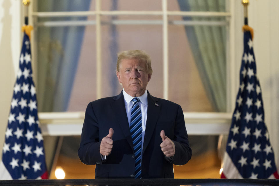President Donald Trump gives thumbs up after returning to the White House following coronavirus treatment.