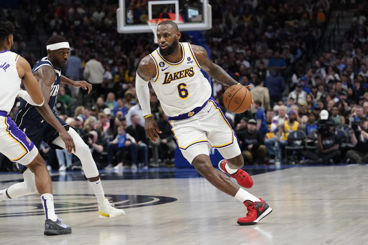 Los Angeles Lakers forward LeBron James (6) dribbles during the first quarter of an NBA basketball game against the Dallas Mavericks in Dallas, Sunday, Feb. 26, 2023. (AP Photo/LM Otero)
