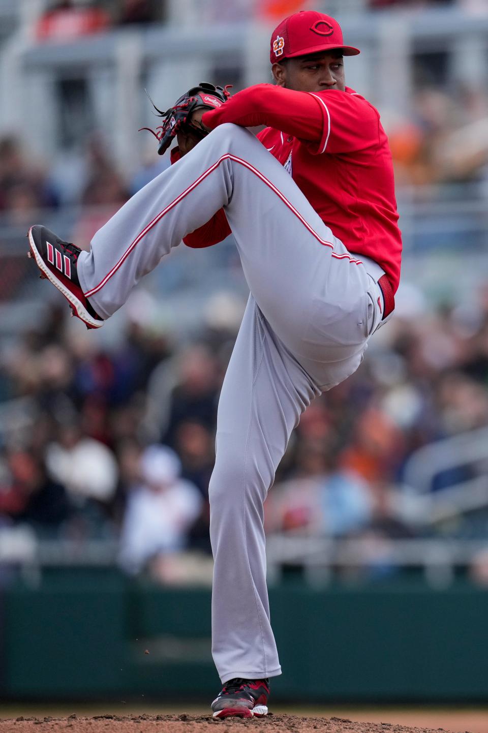 Cincinnati Reds relief pitcher Alexis Diaz winds up to throw a pitch in a spring training game on Feb. 26.