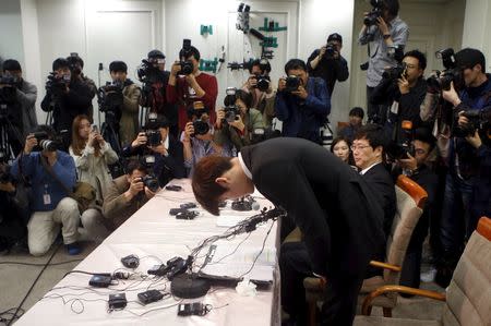 South Korea's Olympic swimming champion Park Tae-hwan bows during a news conference at a hotel in Seoul March 27, 2015. REUTERS/Kim Hong-Ji