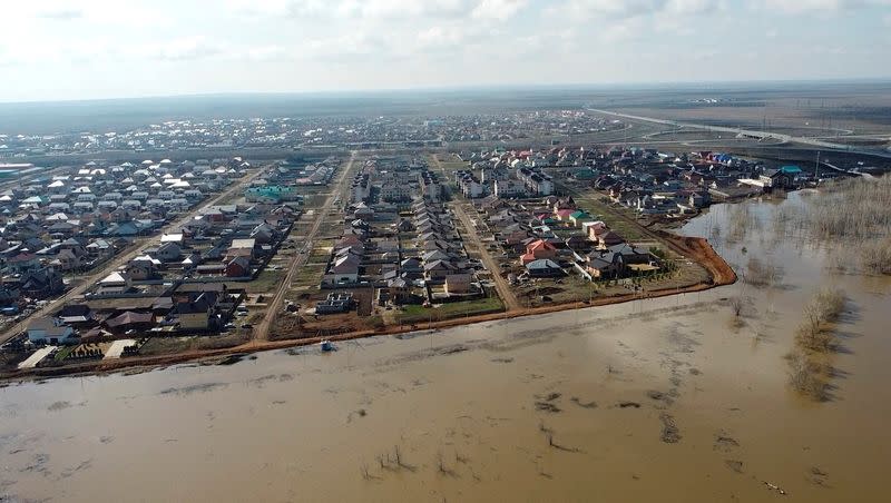 Russian villagers build homemade dam to keep out floods, in Orenburg region