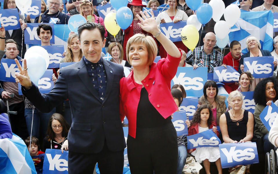 REVIEW OF THE YEAR PICS 2014 File photo dated 8/9/2014 of Deputy First Minister of Scotland Nicola Sturgeon and actor Alan Cumming outside the Yes Kelvin campaign hub in Glasgow ahead of the Scottish independence referendum vote on September 18.