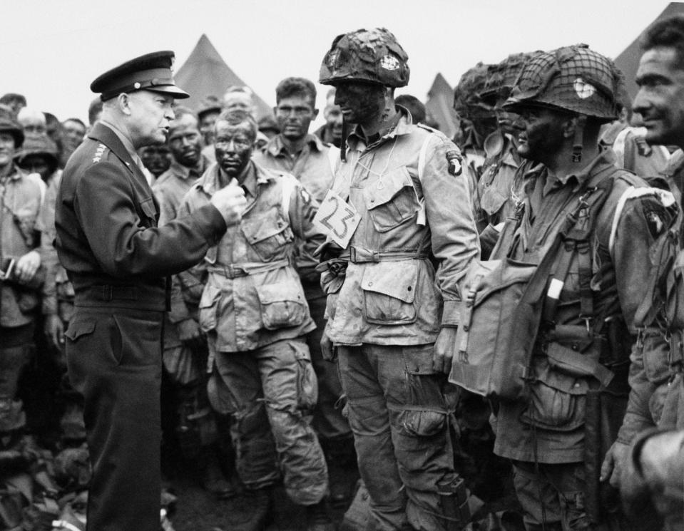 In this June 6, 1944, file photo, U.S. Gen. Dwight D. Eisenhower, left, gives the order of the day to paratroopers in England prior to boarding their planes to participate in the first assault of the Normandy invasion. A dwindling number of D-Day veterans will be on hand in Normandy this June, when international leaders gather to honor them on the invasion’s 75th anniversary. (U.S. Army Signal Corps via AP)