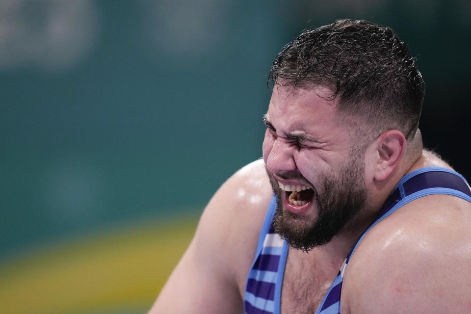 Argentina's Catriel Muriel gestures as he competes with Cuba's Donovan Smith during the men's 125kg wrestling freestyle bronze medal match at the Pan American Games Santiago, Chile, Wednesday, Nov. 1, 2023. (AP Photo/Matias Delacroix)