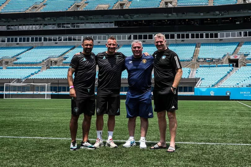 A picture of Carrick Rangers manager Stuart King, assistant manager Scott Irvine and director Jody Hill with Charlotte FC boss Dean Smith