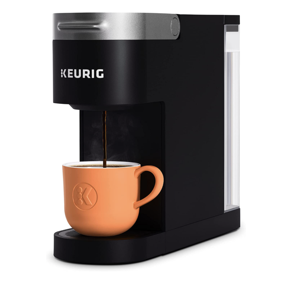 black Keurig K-Slim Single Serve K-Cup Pod Coffee Maker with orange cup of coffee