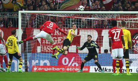 Soccer Football - Bayern Munich v Borussia Dortmund - DFB Pokal Semi Final - Allianz Arena, Munich, Germany - 26/4/17 Bayern Munich's Javi Martinez heads at goal Reuters / Michael Dalder Livepic