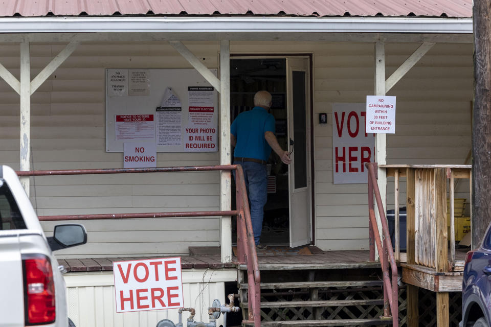 FILE - A voter enters Tuscaloosa County Ward 5, Montgomery Fire Department, to vote during a primary election, March 5, 2024, in Northport, Ala. Voters in a new Alabama congressional district at the center of an ongoing legal and political dispute will return to the polls Tuesday, April 16, 2024, to select the nominees in a U.S. House contest that could help decide control of the narrowly divided chamber this November. (AP Photo/Vasha Hunt, File)