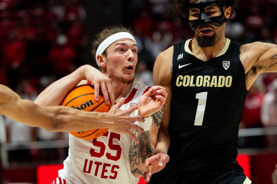 Utah Utes guard Gabe Madsen (55) drives the ball with Colorado Buffaloes forward Tristan da Silva (23) and Colorado Buffaloes guard J’Vonne Hadley (1) on defense during the men’s college basketball game between the Utah Utes and the Colorado Buffaloes at the Jon M. Huntsman Center in Salt Lake City on Saturday, Feb. 3, 2024. | Megan Nielsen, Deseret News