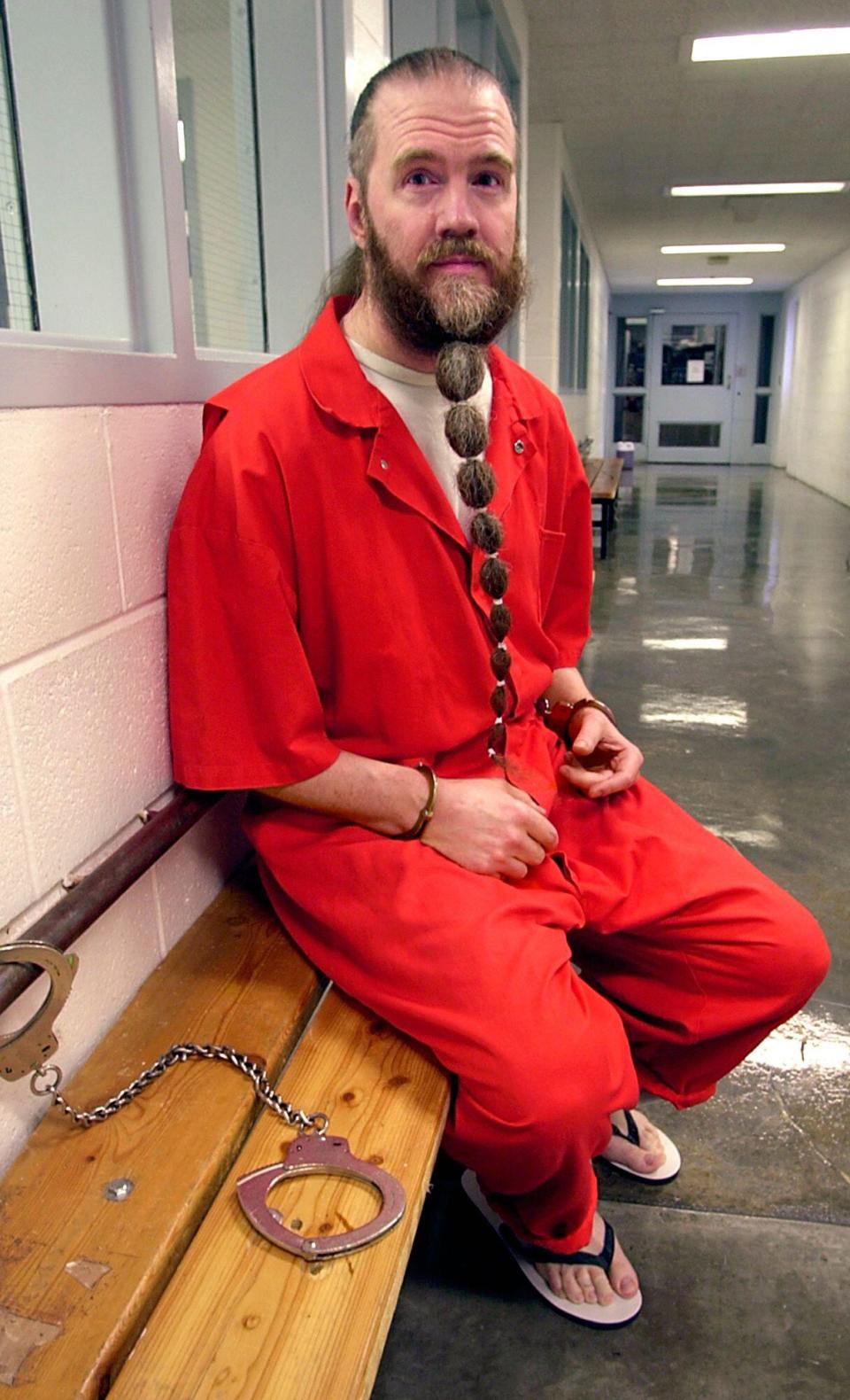 Dan Lafferty poses for a photo, Monday, June 30, 2003, at Utah State Prison in Draper, Utah. When Lafferty and his brother decided to practice polygamy, they killed their sister-in-law and her child because the mother had opposed them. Best-selling author John Krakauer's upcoming book is already creating headaches for the image-conscious Mormon church. 