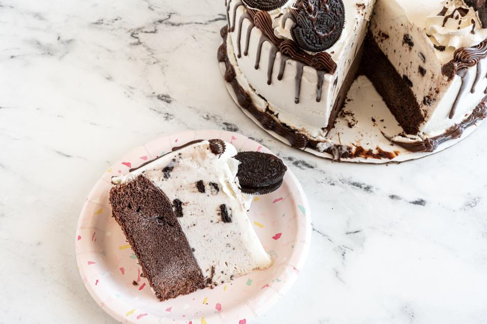 an oreo ice cream cake with a slice