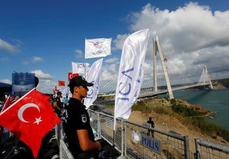 A riot police stands guard during the opening ceremony of newly built Yavuz Sultan Selim bridge, the third bridge over the Bosphorus linking the city's European and Asian sides in Istanbul, Turkey, August 26, 2016. REUTERS/Murad Sezer