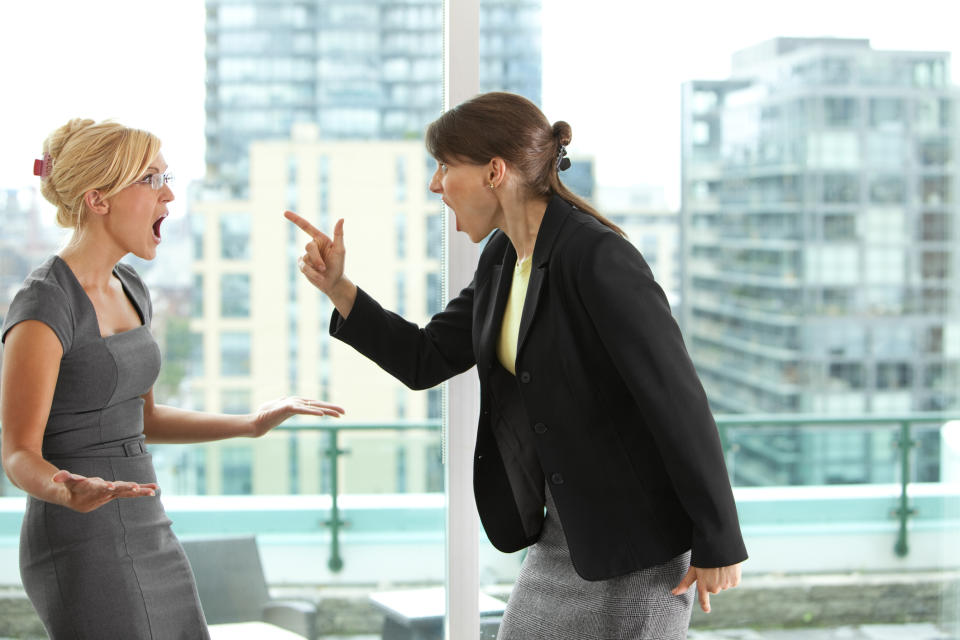 Coworkers arguing in an office