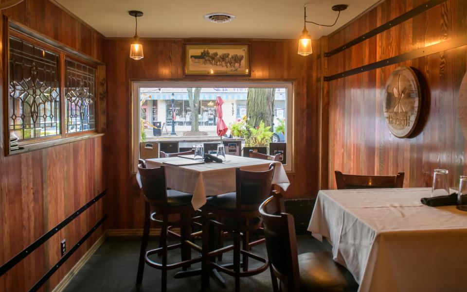 A picture window looking out on Prospect Road in Peoria Heights' business district illuminates a pair of tables at Hearth Restaurant.