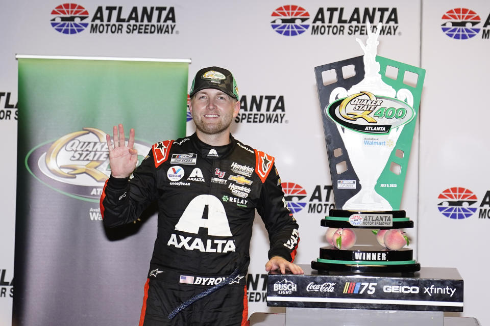 William Byron celebrates in victory lane after winning a NASCAR Cup Series auto race at Atlanta Motor Speedway on Sunday, July 9, 2023, in Hampton, Ga. (AP Photo/Brynn Anderson)