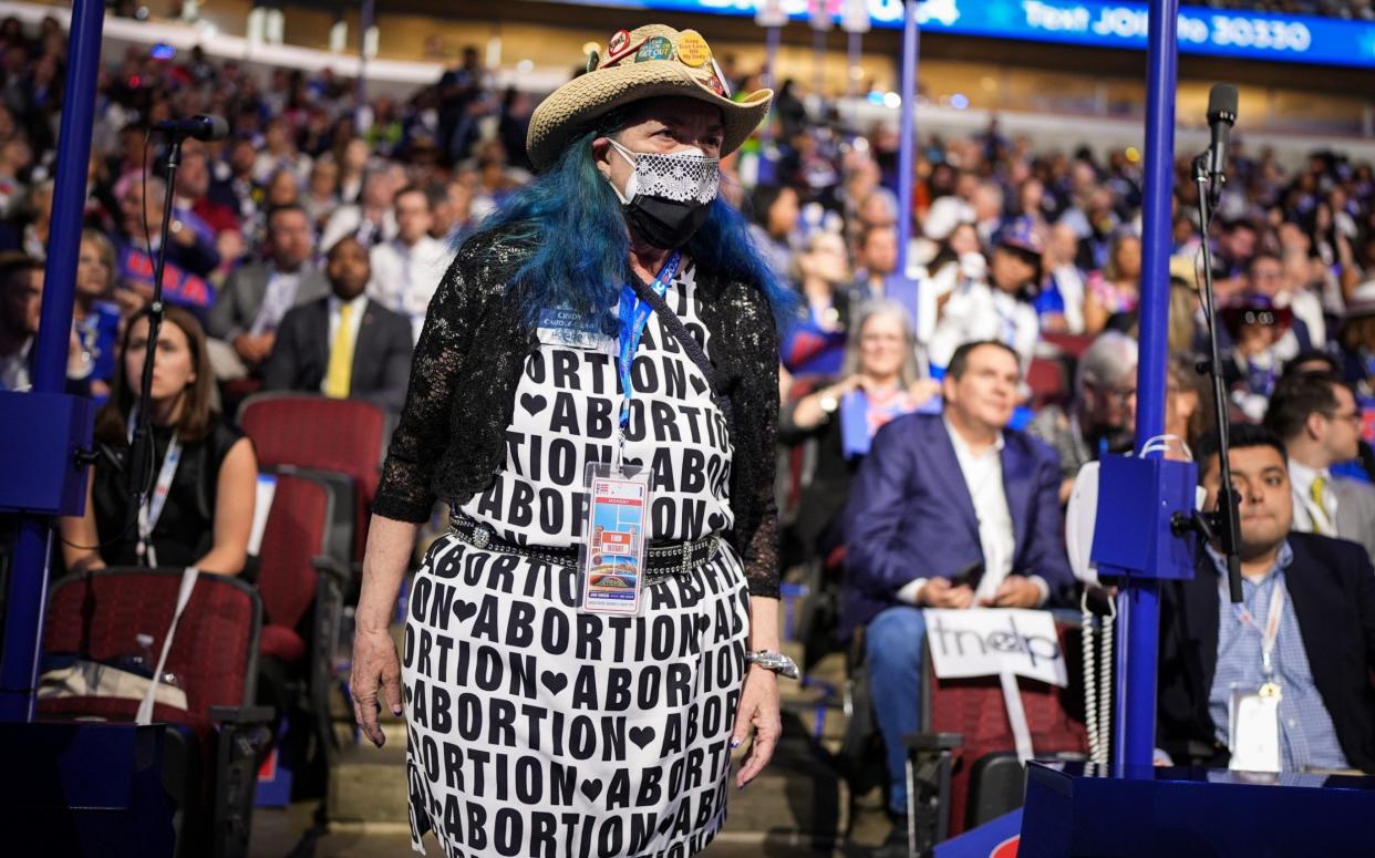 A pro-abortion attendee stands during the first day of the Democratic National Convention at Chicago's United Centre