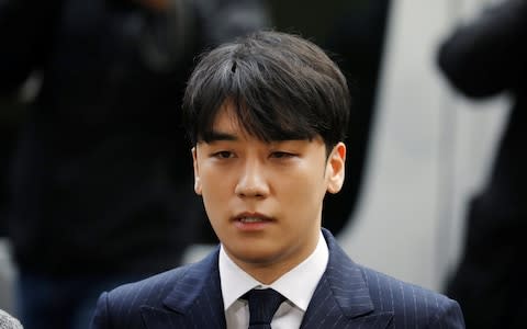 Seungri, a former member of K-pop band Big Bang, faces charges in a sex scandal case - Credit: Kim Hong-ji/Reuters