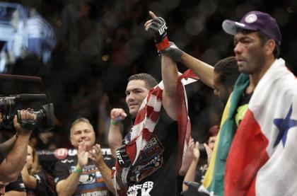 Chris Weidman celebrates after defeating Lyoto Machida at UFC 175 Saturday. (AP Photo/John Locher)