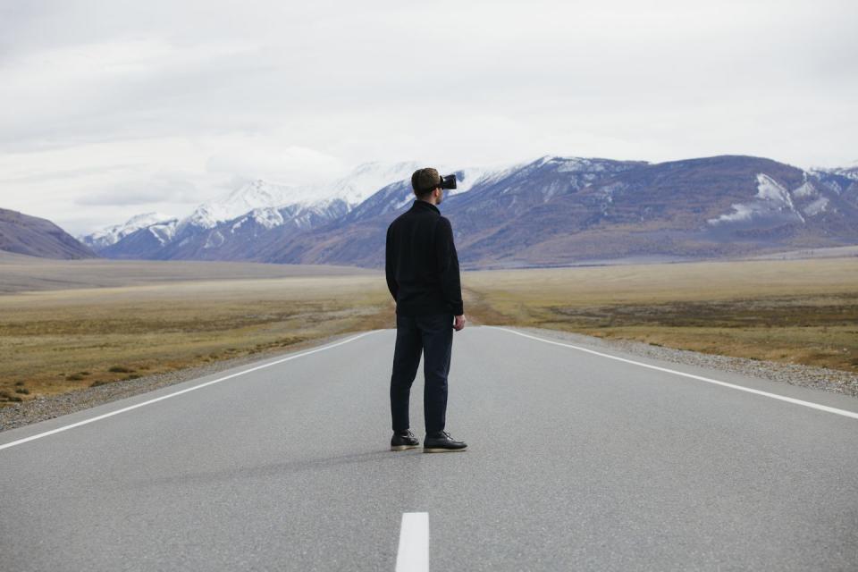 man wearing vr headset and having immersive experience in nature