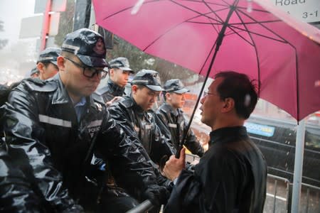 Police prevent Civic Party politician Kwok Ka-ki from approaching Government House in Hong Kong